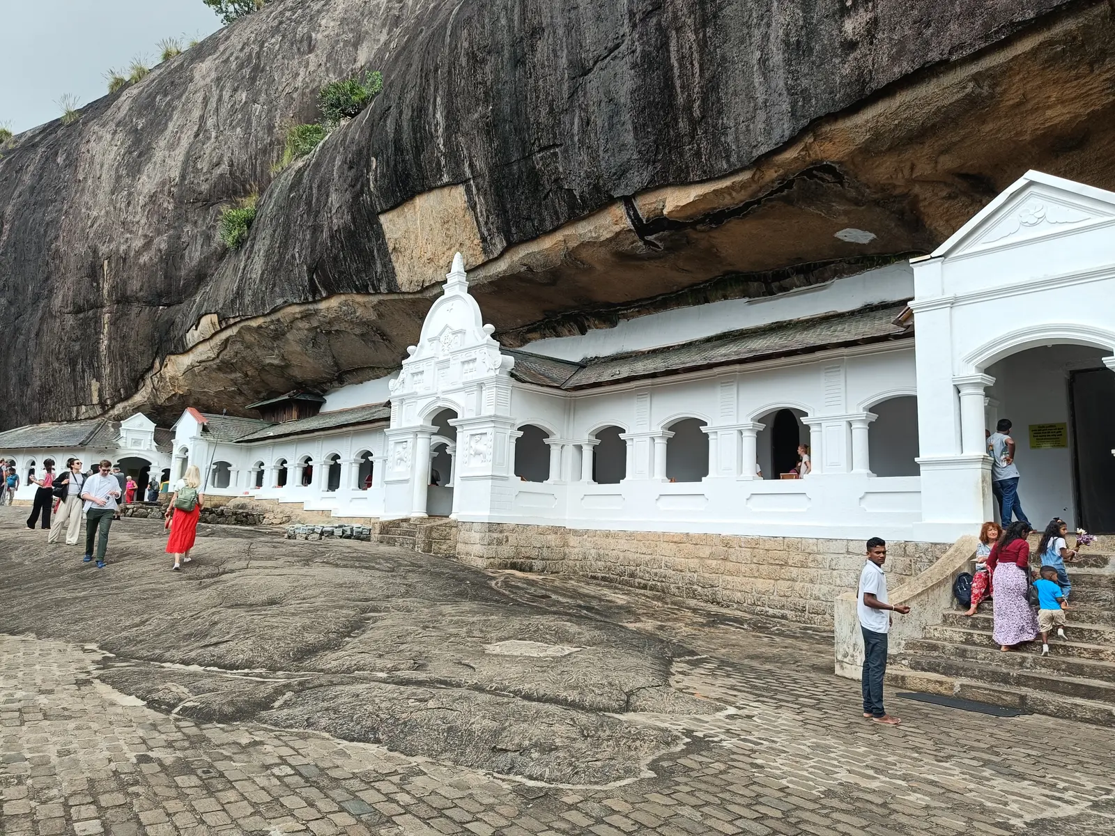 Dambulla Cave Temple built beneath its towering rock